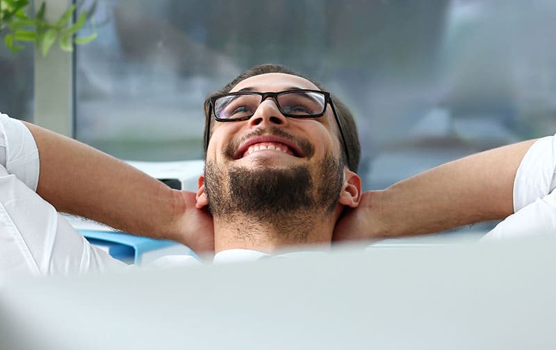 Man relaxing and smiling up at the ceiling